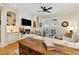 Bright living room with a fireplace, built in shelves, and access to a balcony through french doors at 77 Peachtree Ne Pl # 101, Atlanta, GA 30309