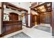 Condo lobby featuring wood trim, tile floors, a reception desk, artwork, and elevators at 77 Peachtree Ne Pl # 101, Atlanta, GA 30309