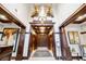Condo lobby featuring wood trim, tile floors, a reception desk, artwork, and elevators at 77 Peachtree Ne Pl # 101, Atlanta, GA 30309
