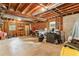 Unfinished basement space with exposed wood and windows, ready for your creative ideas and storage needs at 100 Spring Ridge Ct, Roswell, GA 30076