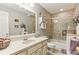 Bright bathroom with a large mirror, shower-tub combination, and neutral tile, creating a clean, inviting space at 100 Spring Ridge Ct, Roswell, GA 30076