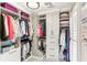 Walk-in closet with custom shelving and ample storage space for clothing and accessories at 100 Spring Ridge Ct, Roswell, GA 30076