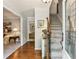 Inviting foyer with hardwood floors, staircase, and views into adjacent living spaces at 100 Spring Ridge Ct, Roswell, GA 30076