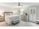 Serene main bedroom with neutral tones, plantation shutters, and a ceiling fan at 100 Spring Ridge Ct, Roswell, GA 30076