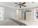 Comfortable main bedroom featuring a ceiling fan, walk-in closet, and a neutral color palette, offering a relaxing retreat at 100 Spring Ridge Ct, Roswell, GA 30076