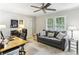 Functional office space with a comfortable sofa, desk, and ample natural light at 100 Spring Ridge Ct, Roswell, GA 30076