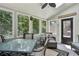Bright sunroom with a ceiling fan, skylight, and multiple windows offering great natural light at 100 Spring Ridge Ct, Roswell, GA 30076