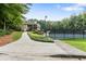 Community tennis court with a walking path, offering convenient recreational opportunities at 100 Spring Ridge Ct, Roswell, GA 30076