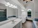 Luxurious bathroom featuring dual vanities, an elegant soaking tub, and a glass-enclosed shower at 110 Wyngate Way, Fayetteville, GA 30215