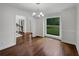Formal dining room with hardwood floors, large window, and crown molding at 110 Wyngate Way, Fayetteville, GA 30215