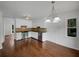 Kitchen with stainless steel appliances, white cabinets, and a view to outdoors at 110 Wyngate Way, Fayetteville, GA 30215