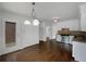 Eat-in kitchen with stainless appliances, white cabinets, and view to the outdoors at 110 Wyngate Way, Fayetteville, GA 30215