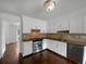 Kitchen features stainless steel appliances, tiled backsplash, white cabinets and eat-in area at 110 Wyngate Way, Fayetteville, GA 30215