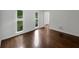 Bright, open living room with hardwood floors and a double window at 110 Wyngate Way, Fayetteville, GA 30215