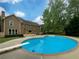 Beautiful backyard pool with diving board and spacious patio for outdoor enjoyment at 110 Wyngate Way, Fayetteville, GA 30215