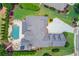 An aerial view of a luxurious property showcasing a well-maintained yard, pool, and patio at 120 Slate Dr, Buford, GA 30518