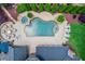 Aerial view showcasing a luxurious pool, patio, firepit, outdoor seating, and lush landscaping at 120 Slate Dr, Buford, GA 30518