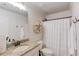 Bathroom featuring shiplap walls, a granite countertop vanity, and a shower-tub combination at 120 Slate Dr, Buford, GA 30518