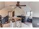 Cozy bonus room features hardwood floors, natural light, and a cute table and piano space at 120 Slate Dr, Buford, GA 30518