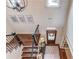 Grand foyer showcasing hardwood floors, elegant staircase, chandelier, and well-lit entryway at 120 Slate Dr, Buford, GA 30518