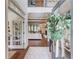 Elegant foyer with hardwood floors, open layout, and views of the living room and dining area, exuding sophistication at 120 Slate Dr, Buford, GA 30518