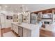 Open-concept kitchen and living room with fireplace at 120 Slate Dr, Buford, GA 30518
