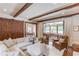 Cozy living room with exposed beams, comfortable seating, and an inviting atmosphere, perfect for relaxation and entertaining at 120 Slate Dr, Buford, GA 30518