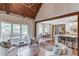 Bright open-concept living space with hardwood floors and seamless flow to the kitchen and dining areas at 120 Slate Dr, Buford, GA 30518