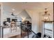 Lofted living room with a seating area, bar, and a statement chandelier over a stairwell at 120 Slate Dr, Buford, GA 30518