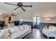 Comfortable living room with hardwood floors, large windows, comfortable seating, and dark wood trim at 120 Slate Dr, Buford, GA 30518