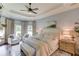 Luxurious main bedroom with tray ceiling, large windows, and designer finishes at 120 Slate Dr, Buford, GA 30518