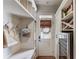 Stylish mudroom features built-in storage, bench seating, wine cooler and direct outdoor access at 120 Slate Dr, Buford, GA 30518