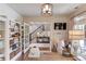 Well-appointed home office with a desk, bookshelves, and comfortable seating, offering a versatile and functional space at 120 Slate Dr, Buford, GA 30518