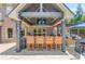 This outdoor kitchen area includes bar seating, a grill, and stylish design at 120 Slate Dr, Buford, GA 30518