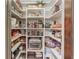 Well-organized walk-in pantry offering ample storage with custom shelves and container organization at 120 Slate Dr, Buford, GA 30518