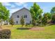 A spacious backyard with green grass, bordered by a black fence, creating an inviting outdoor space at 4583 Grenadine Cir, Acworth, GA 30101