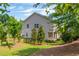 Backyard of a home with a black aluminum fence and lush landscaping at 4583 Grenadine Cir, Acworth, GA 30101