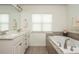 Bathroom features double sink vanity, soaking tub, and towel racks at 4583 Grenadine Cir, Acworth, GA 30101