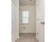 Bathroom featuring a shower with a curtain, a window, and tile floors at 4583 Grenadine Cir, Acworth, GA 30101