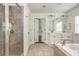 Bright bathroom with a glass shower, double vanity, and ample natural light at 4583 Grenadine Cir, Acworth, GA 30101