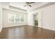 Primary bedroom with tray ceiling, hardwood floors and an en suite bathroom at 4583 Grenadine Cir, Acworth, GA 30101