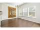 Open dining area features hardwood floors, large windows, and modern chandelier at 4583 Grenadine Cir, Acworth, GA 30101