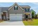 Charming two-story home with a two-car garage, well-manicured lawn and appealing curb appeal at 4583 Grenadine Cir, Acworth, GA 30101