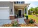 Charming front porch with elegant black front door and nicely landscaped flower beds at 4583 Grenadine Cir, Acworth, GA 30101