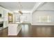 Kitchen and Dining area with modern appliances, island with sink and hardwood floors at 4583 Grenadine Cir, Acworth, GA 30101