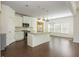 Open concept kitchen with white cabinets, stainless appliances and island with sink at 4583 Grenadine Cir, Acworth, GA 30101
