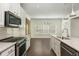 Bright kitchen includes stainless appliances, a center island with sink, and ample counter space at 4583 Grenadine Cir, Acworth, GA 30101