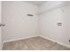 Large laundry room with tile flooring and overhead storage shelf at 4583 Grenadine Cir, Acworth, GA 30101