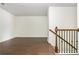 Spacious living room has hardwood floors, a staircase with iron spindles and tons of natural light at 4583 Grenadine Cir, Acworth, GA 30101