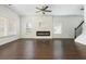 Spacious living room featuring a modern fireplace with hardwood floors and large windows at 4583 Grenadine Cir, Acworth, GA 30101